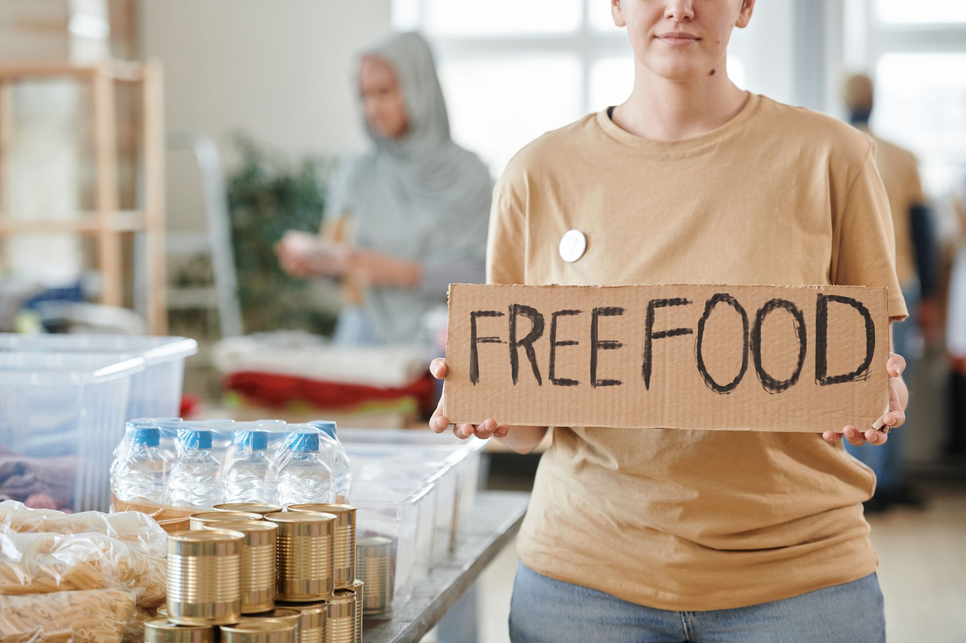 Volunteers sorting food parcels at a UK food bank used by working families