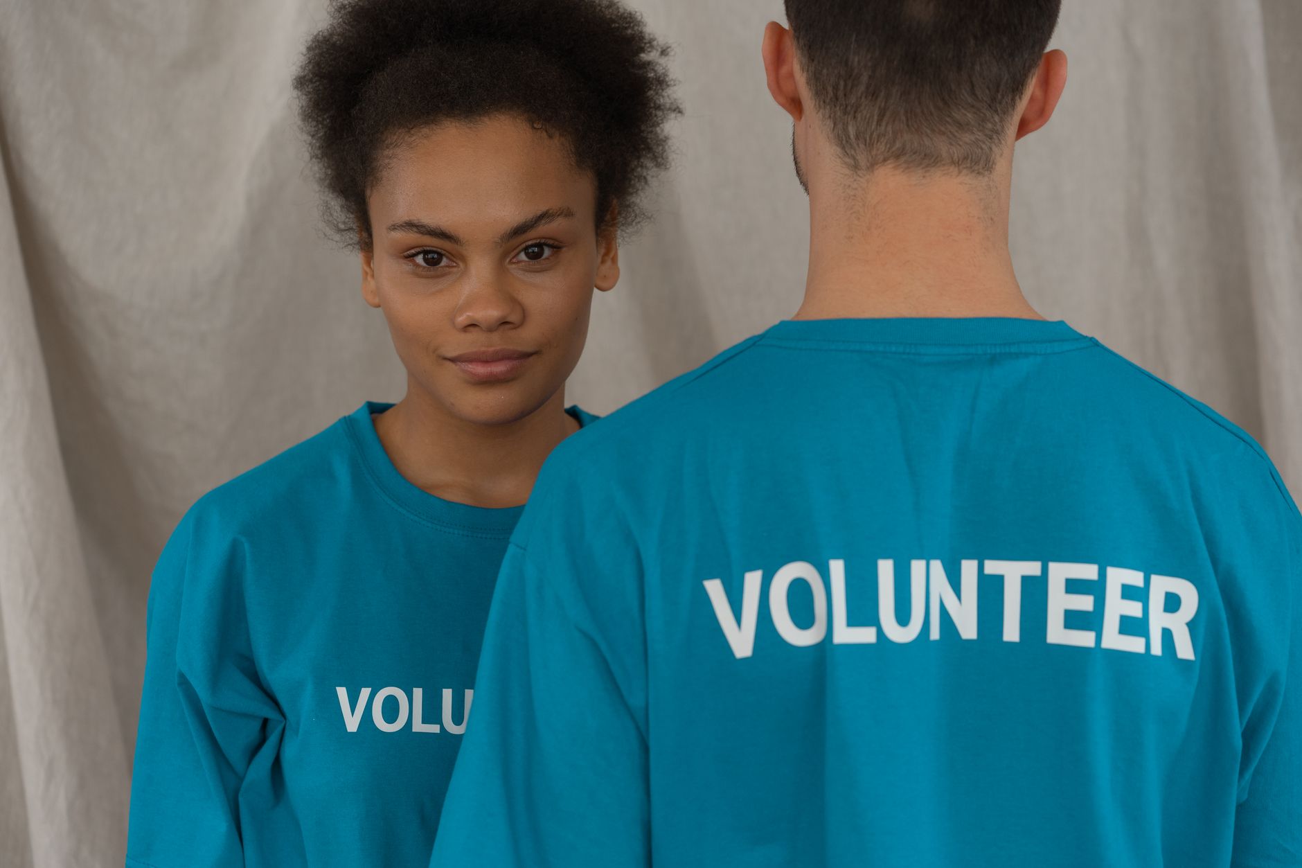 Volunteer committee planning grassroots Christmas community events with printed materials